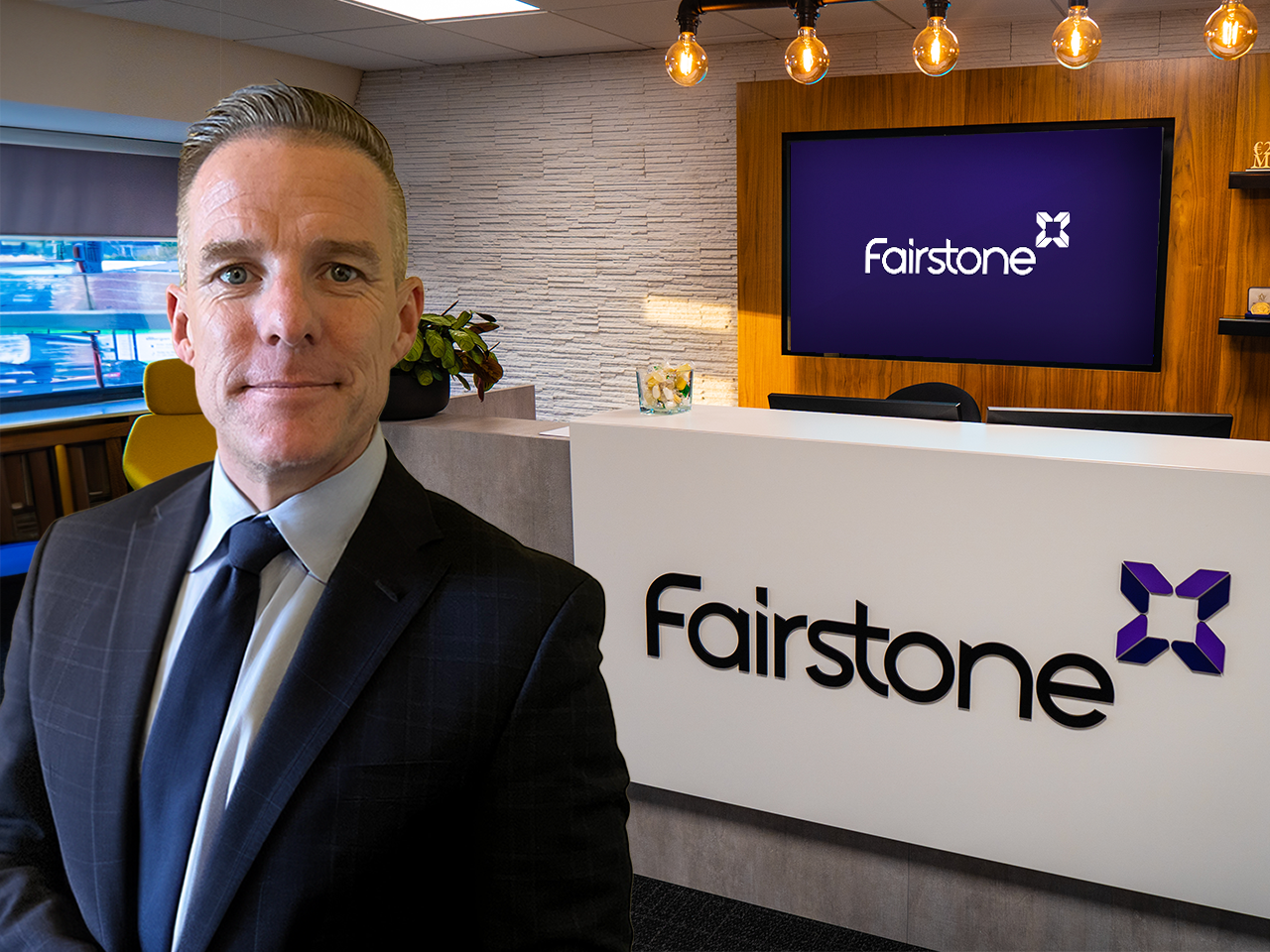 Fairstone Ireland CEO Paul Merriman with the Fairstone logo background