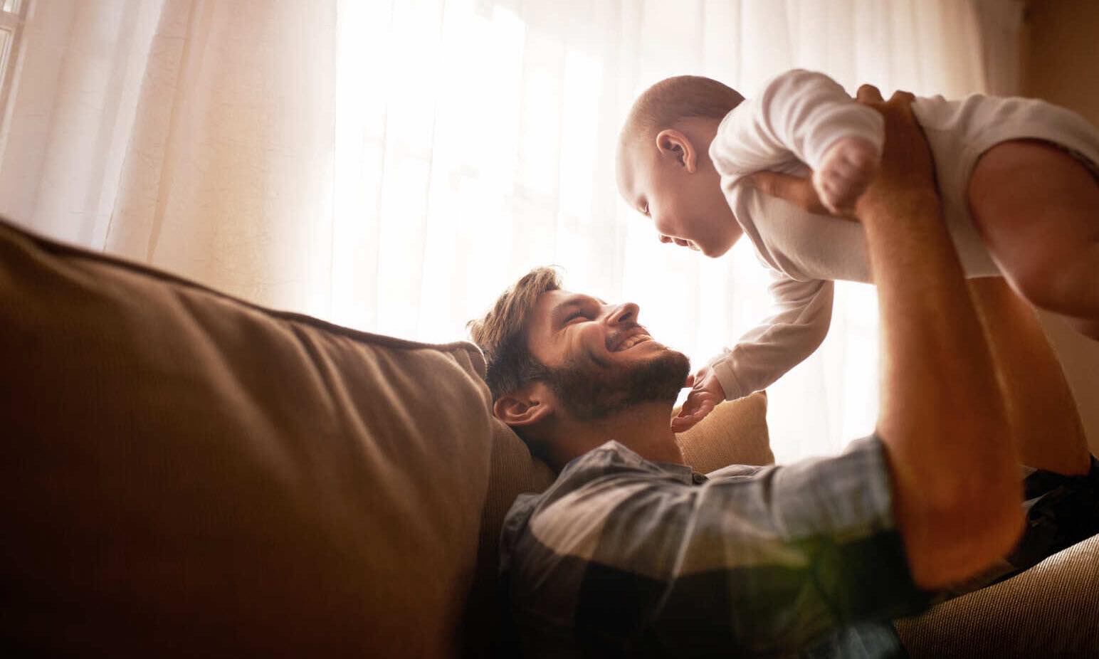 Cropped shot of an affectionate father bonding with his baby girl at home